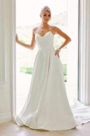 PEAKED CROSSOVER NECKLINE PARTIAL COVERAGE BACK CHAPEL TRAIN