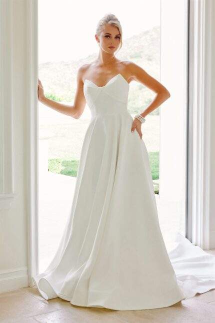 PEAKED CROSSOVER NECKLINE PARTIAL COVERAGE BACK CHAPEL TRAIN